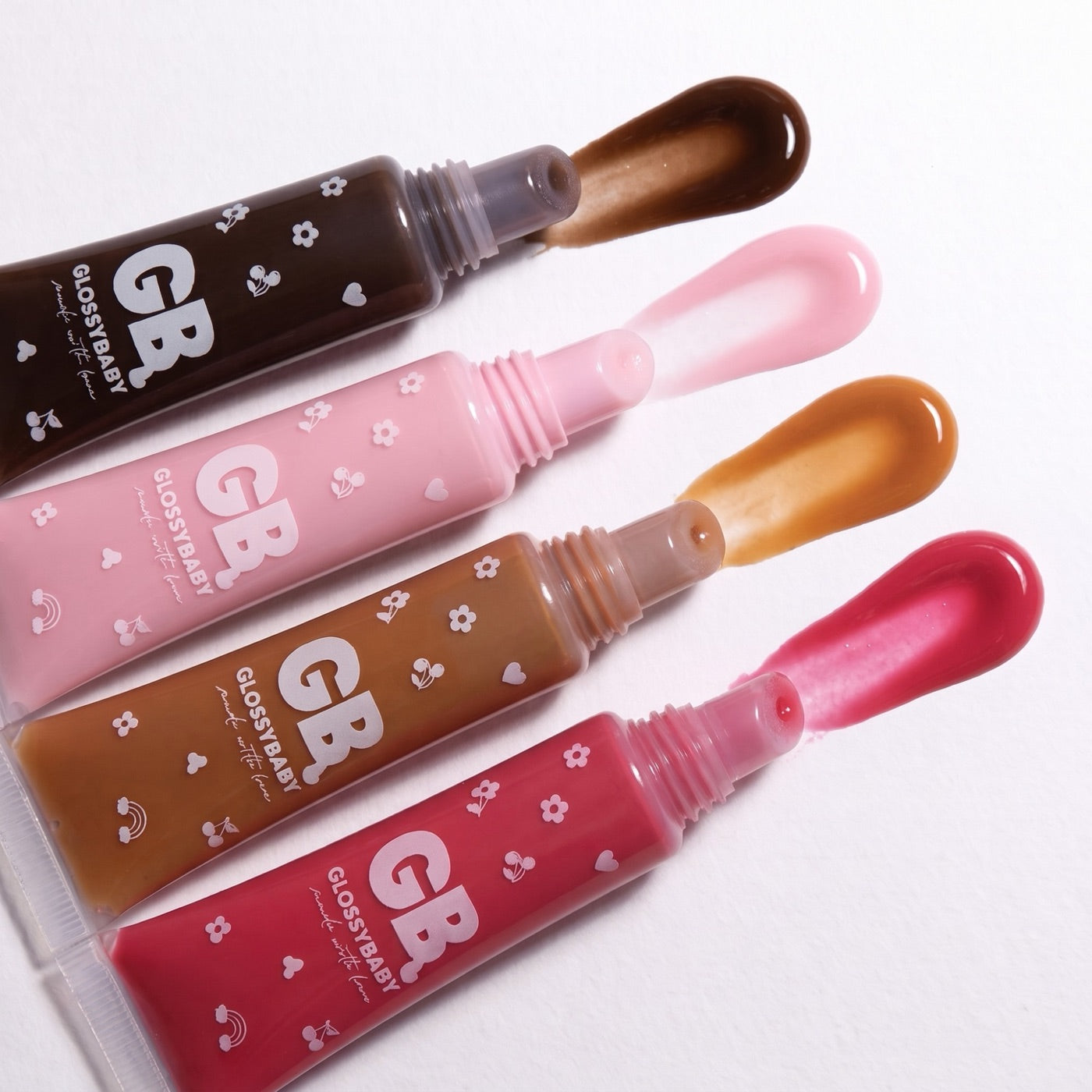 GlossyBaby lip gloss tubes with swatches